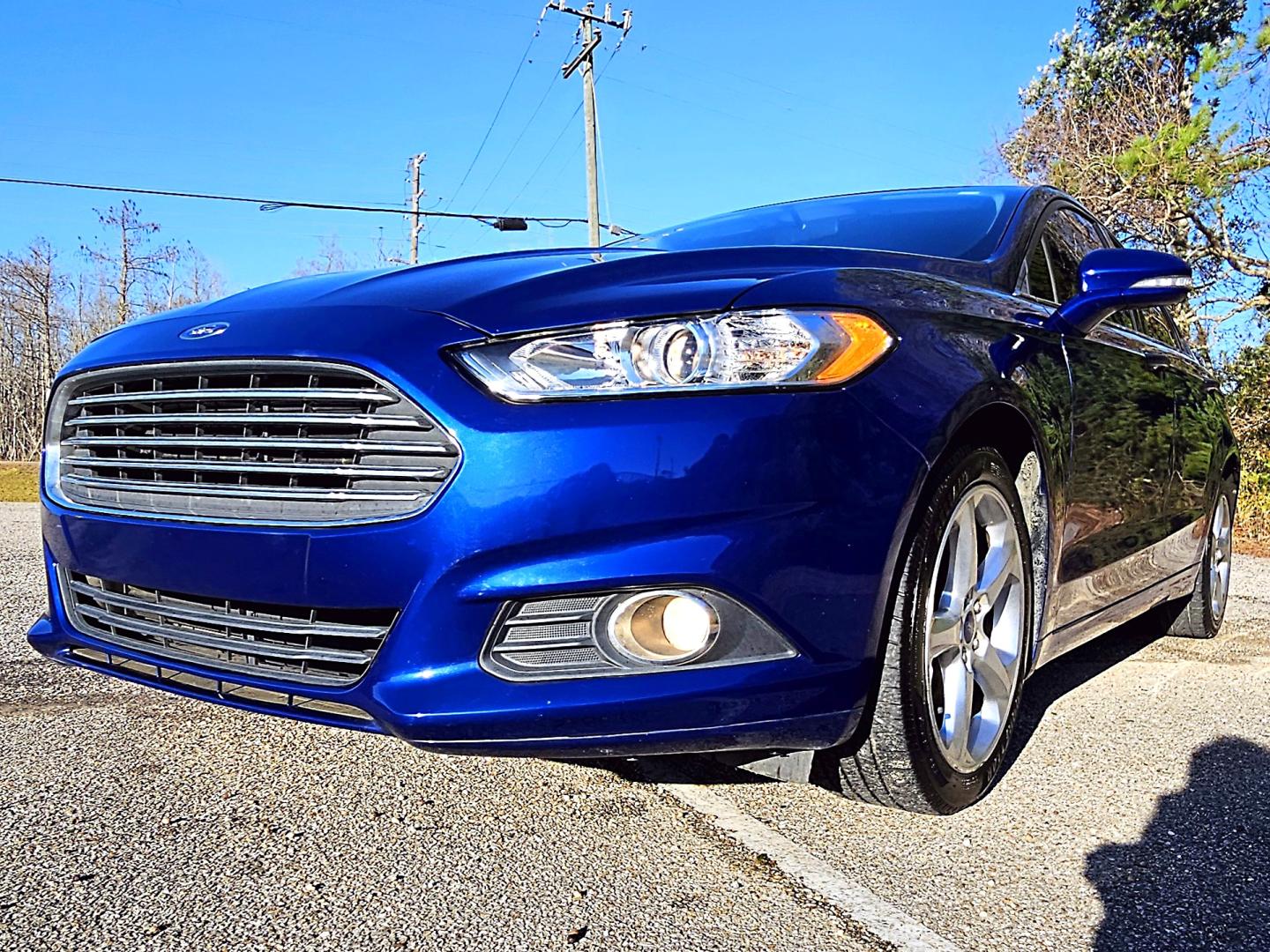 2015 Blue Ford Fusion SE (3FA6P0T96FR) with an 2.0L L4 DOHC 16V engine, Automatic transmission, located at 18001 Kellogg Rd, Saucier, MS, 39574, (228) 832-1441, 39.421459, -76.641457 - Photo#1